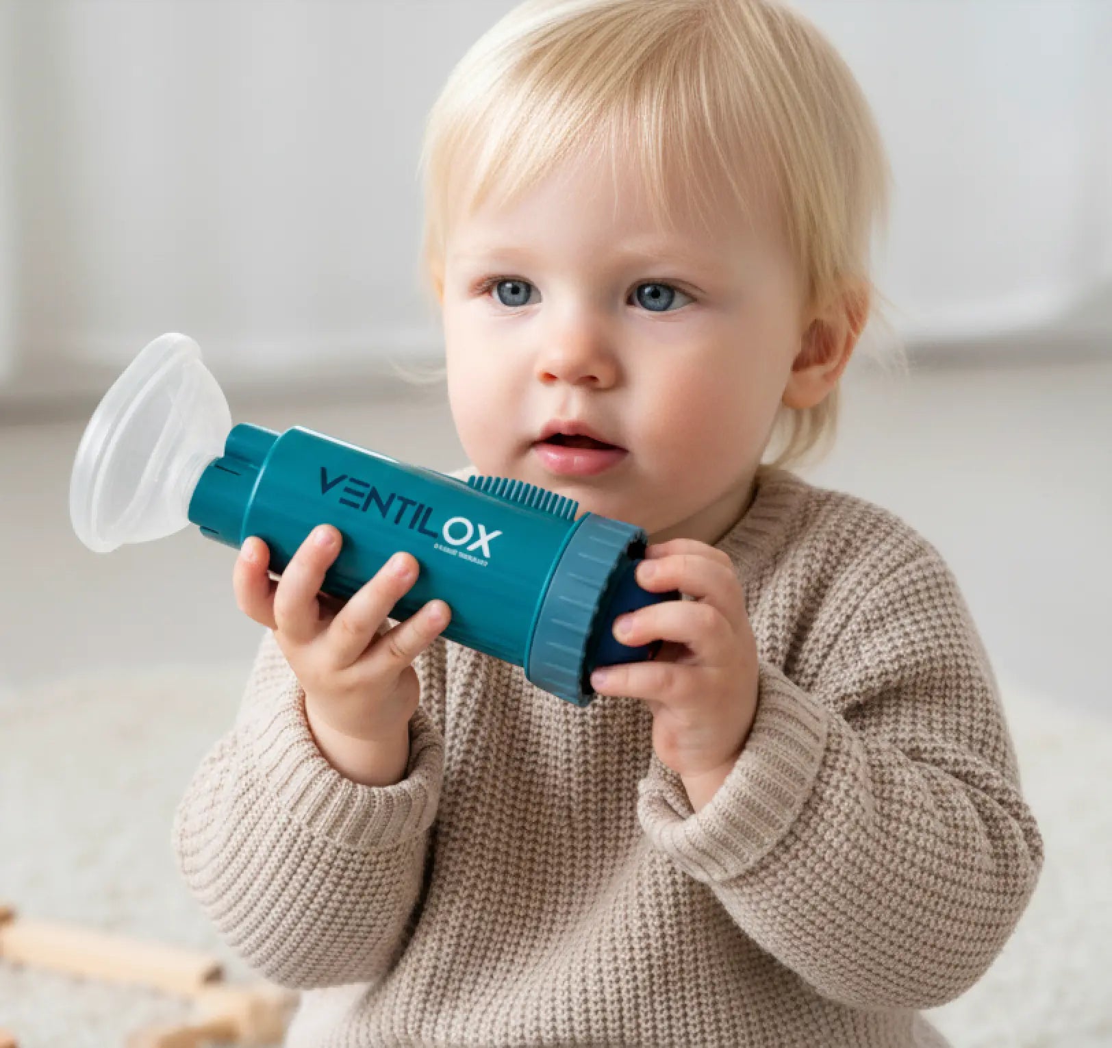 Child holding Ventilox product
